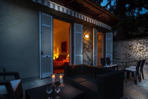 a patio with a table and some candles on it at Villa Cernobbio in Cernobbio