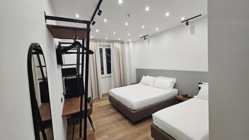 Ένα ή περισσότερα κρεβάτια σε δωμάτιο στο Hotel La Superba