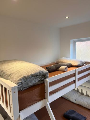 a bedroom with a bunk bed in a room at 1 Bedroom & Bathroom (No kitchen) (Garden) (Driveway) in Dorney
