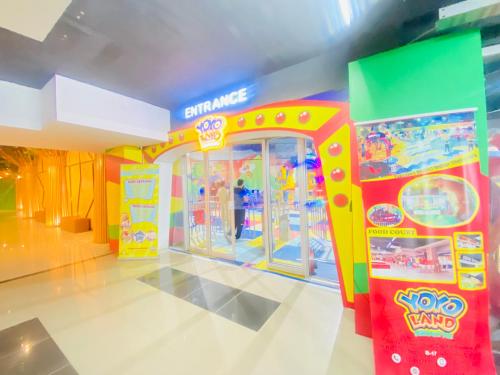 a brightly colored room with a toy arcade at One Bed Executive Apartment in Islamabad