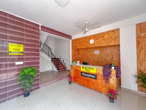 a lobby with a reception desk in a building at Hotel Elite by Agira- Spacious Apartments with Balcony in Yelahanka