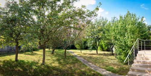 a path in a park with trees and stairs at Résidence Artemis Paris Orly Aéroport in Villeneuve-le-Roi