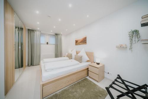 Una cama o camas en una habitación de Ferienwohnung am Weinberg