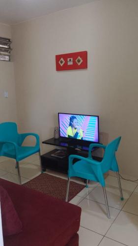 TV a/nebo společenská místnost v ubytování Kit Apartamento Central