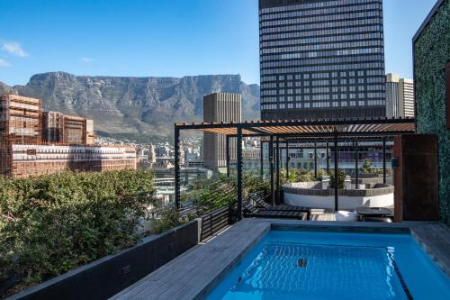 a pool on the roof of a building with a view at 208, The Duke - Luxury apartment with city views in Cape Town