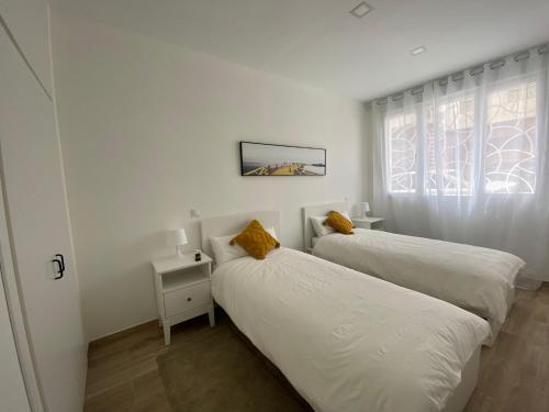 Postel nebo postele na pokoji v ubytování ALOJAMIENTO TURISTICO LAS VISTILLAS MADRID RIO