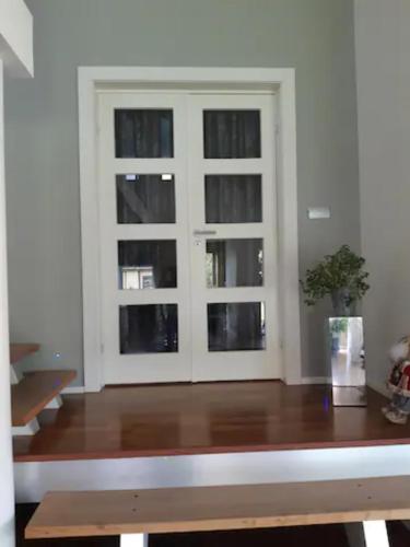 a room with a window and a wooden table at Rum i Villa in Jönköping