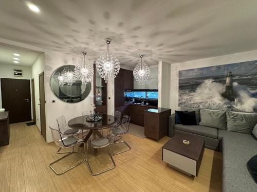 a living room with a couch and a table at Apartment Kovacevic With Sea View in Pržno