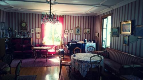 a living room with a couch and a table at Fridhems Pensionat in Visby