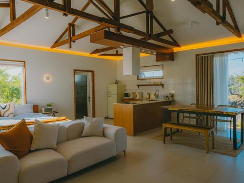 a living room with a couch and a table at Stay Maeumgyul - Aewol Jacuzzi Pension in Jeju