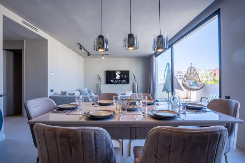 a dining room with a large table and chairs at TWENTY SIX ANFA LUXURY RESIDENCE by Shortstaymaroc -Hyper Centre -Parking in Casablanca