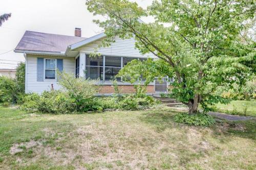 a house with a tree in the yard at Artist’s Vintage Home 5 mins from ND Campus in South Bend