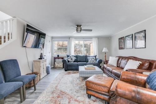 a living room with leather couches and a tv at Cozy Home w/ Sonos + Walking to Notre Dame in South Bend