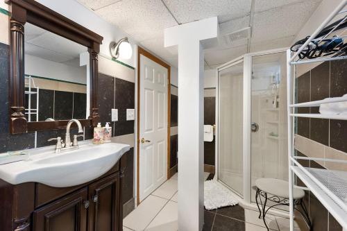 a bathroom with a sink and a shower at AMAZING TRADITIONAL HOME SOUTH MINNEAPOLIS in Minneapolis