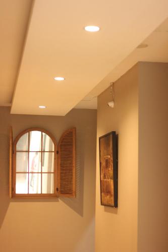a room with a window and a picture on the wall at Bale Ocasa by Behomy in Tangerang