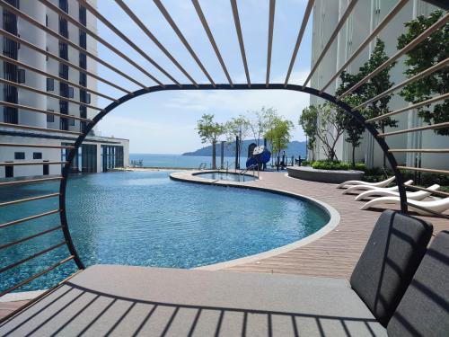 an archway over a swimming pool in a building at Seaview Bliss Studio By Tropical Elegance in Kota Kinabalu