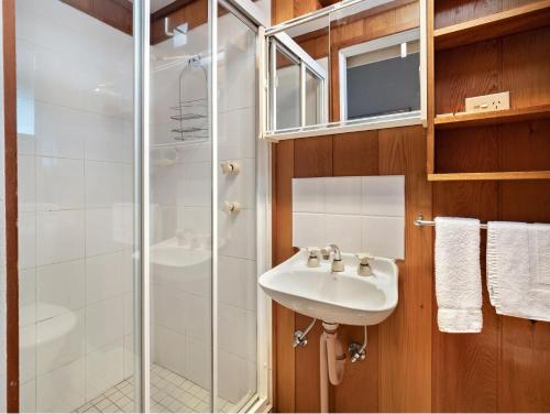 a bathroom with a sink and a shower at Tyrola 1 in Thredbo