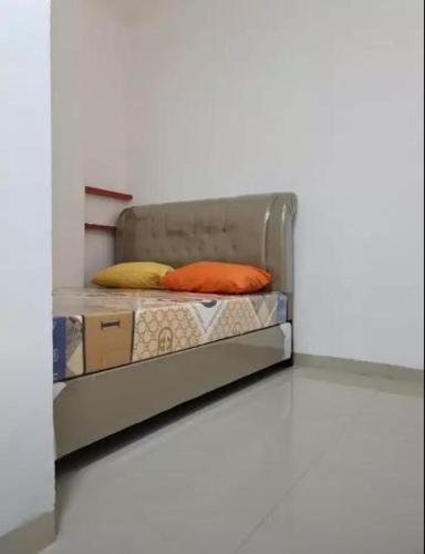 En eller flere senge i et værelse på Highlander Stay Palembang