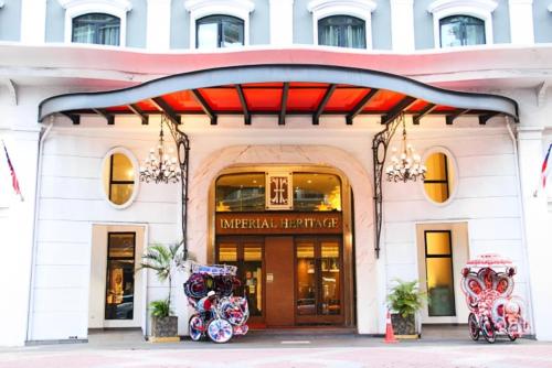 a store front of a building with a red awning at Imperial Heritage Hotel Melaka I City Centre I Free Wifi I Free Parking l Free Club Lounge Access in Malacca