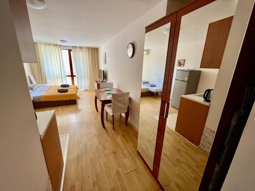 a room with a kitchen and a living room at Julia Vigo Panorama apartments in Nesebar