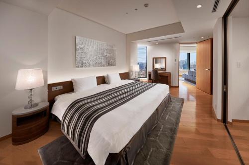 Postel nebo postele na pokoji v ubytování Park Hotel Tokyo