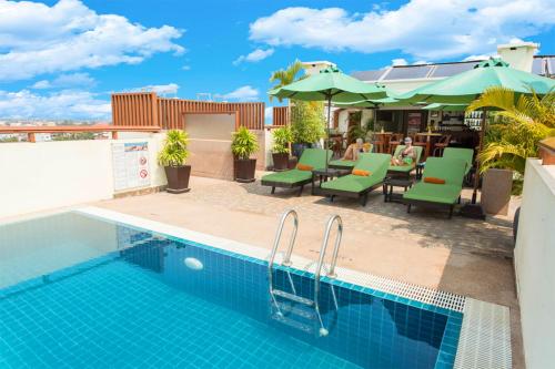 a pool on the roof of a building with a restaurant at Cheathata CTS Hotel Siem Reap in Siem Reap