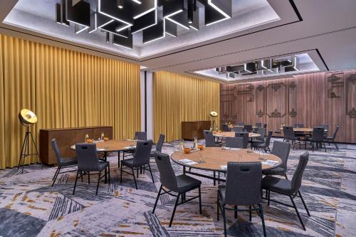 a conference room with tables and chairs in it at Renaissance Kuala Lumpur Hotel & Convention Centre in Kuala Lumpur