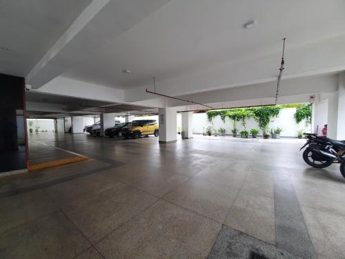 an empty parking garage with motorcycles parked in it at Blue Ocean in Dehiwala