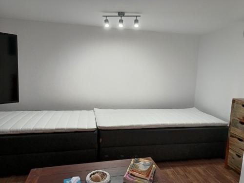 a room with a bed and a table at Thor Freyjas of Poseidonia Syros Holiday House in Posidhonía
