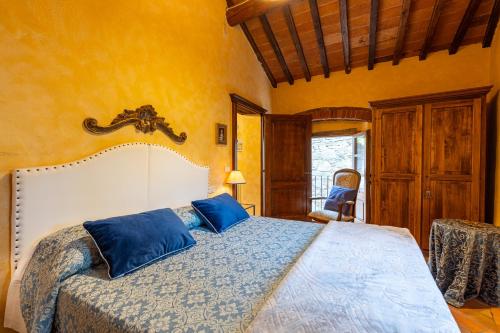 Ένα ή περισσότερα κρεβάτια σε δωμάτιο στο Borgo Dolci Colline Resort Loggia