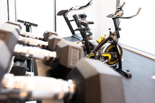 a row of bikes lined up in a room at Hotel Javu in Mamaia Nord