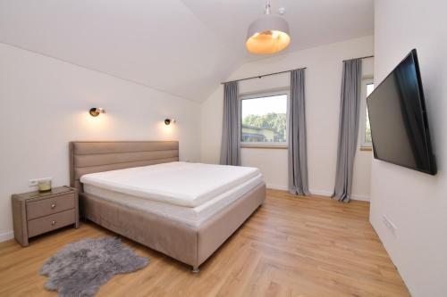 Un pat sau paturi într-o cameră la MG - Namai