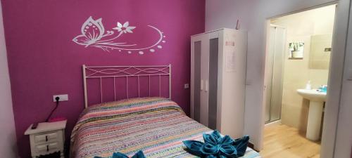 Ένα ή περισσότερα κρεβάτια σε δωμάτιο στο Hostal Hotel EL Chato