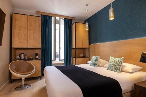 Postel nebo postele na pokoji v ubytování Hôtel Elixir