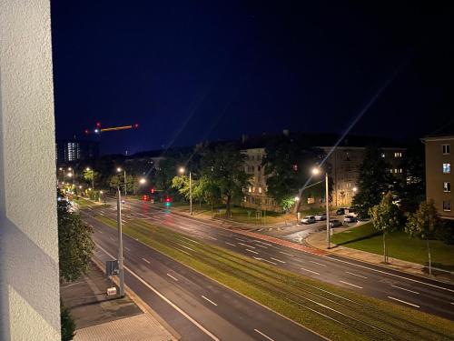 a view of a street at night with street lights at One-room Apartment in Dresden