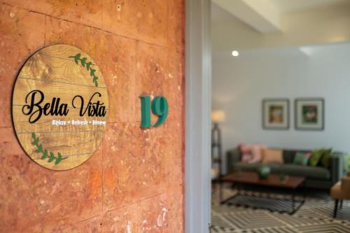 a door with a sign on it in a living room at El Rocio Estate 2bhk in Assagao with Common pool, Free Parking,8 min away from Vagator in Assagao