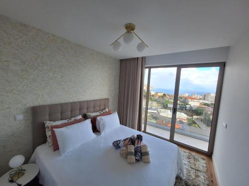 Postel nebo postele na pokoji v ubytování The Quala Place at Madeira Island