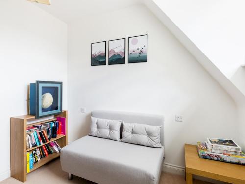 a bedroom with a bed and a book shelf at Pass the Keys Modern 2 Bed in Leamington Spa in Leamington Spa