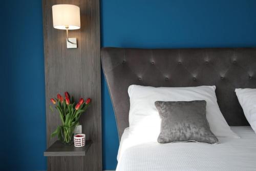 Postel nebo postele na pokoji v ubytování Boutique Hotel Portorose