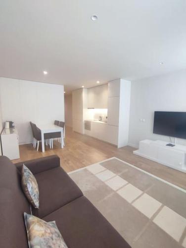 a living room with a couch and a table at Terro Collection - São Vicente 78 in Braga