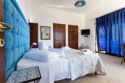 Postel nebo postele na pokoji v ubytování Villa Grazia Lipari