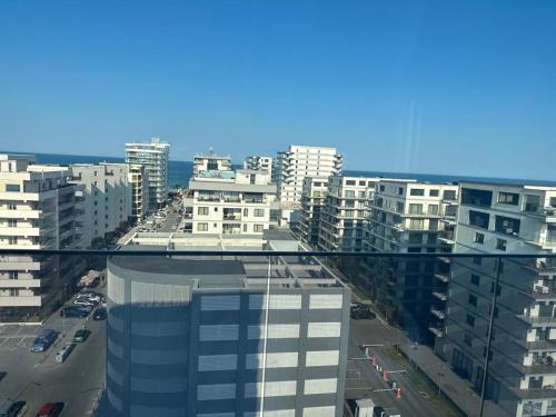 a view of a city from the glass floor of a building at Koya Tower by Lake Mamaia in Mamaia