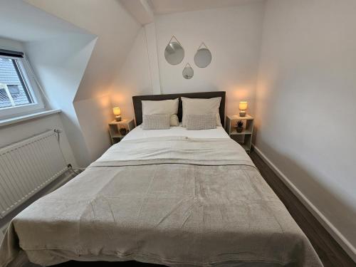 Un pat sau paturi într-o cameră la Ferienwohnung zur Grenze