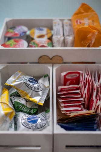 a refrigerator filled with lots of food and snacks at Veroniamo in Verona