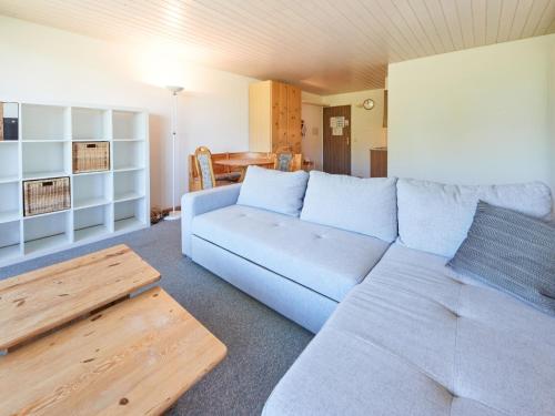 a living room with a couch and a table at Studio Dixence 219 by Interhome in Les Collons