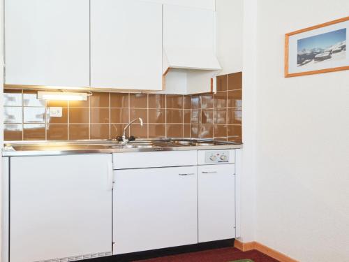 A kitchen or kitchenette at Apartment Arzinol 106 by Interhome