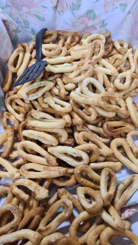 a pile of pretzels on a table with a spoon at "il Casaletto" Agriturismo Moderno, Vista Panoramica e Cibo Spettacolare- Scurcola Marsicana in Scurcola Marsicana