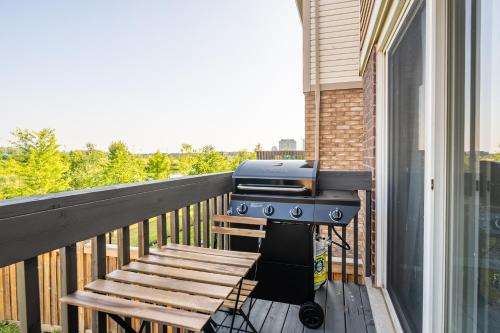 a grill on a balcony with a bench at GLOBALSTAY Modern 3 Bedroom House in Brampton in Brampton