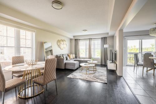 a living room with a couch and a table at GLOBALSTAY Modern 3 Bedroom House in Brampton in Brampton