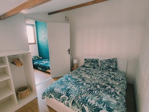 En eller flere senge i et værelse på Maison Times